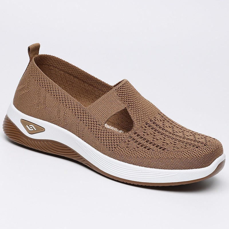 Women's slip-on knit-style trainers with a rounded toe and raised white sole