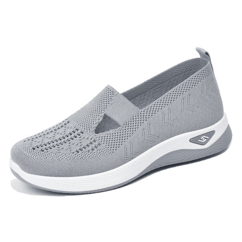 Women's slip-on knit-style trainers with a rounded toe and raised white sole