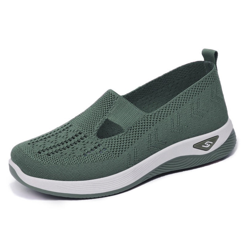 Women's slip-on knit-style trainers with a rounded toe and raised white sole