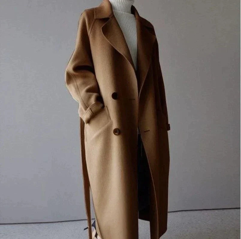 Women's long plain tailored coat with lapel collar and button front