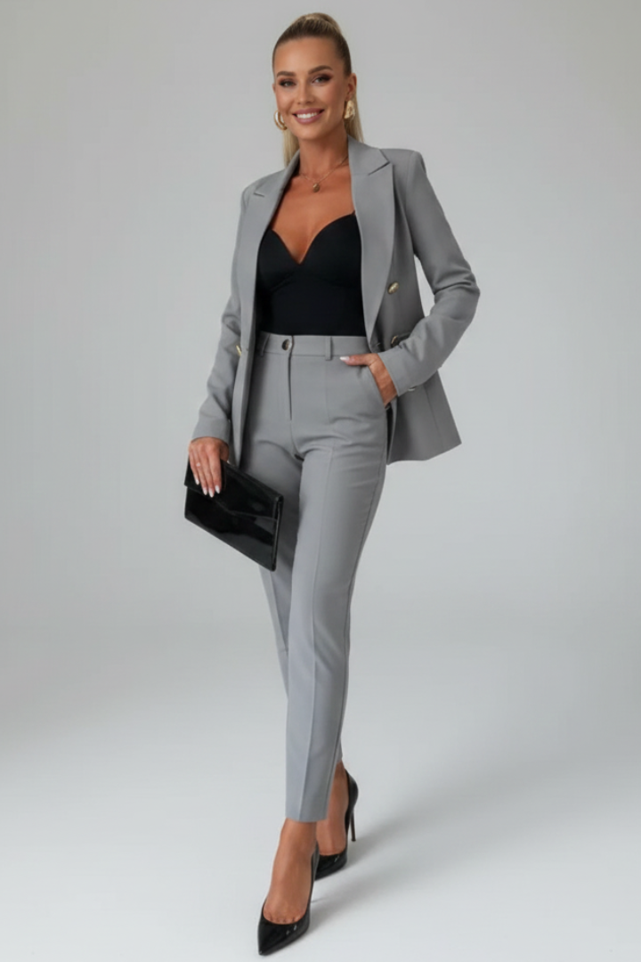Women's tailored blazer and slim trouser suit set with notched lapels and button fastening