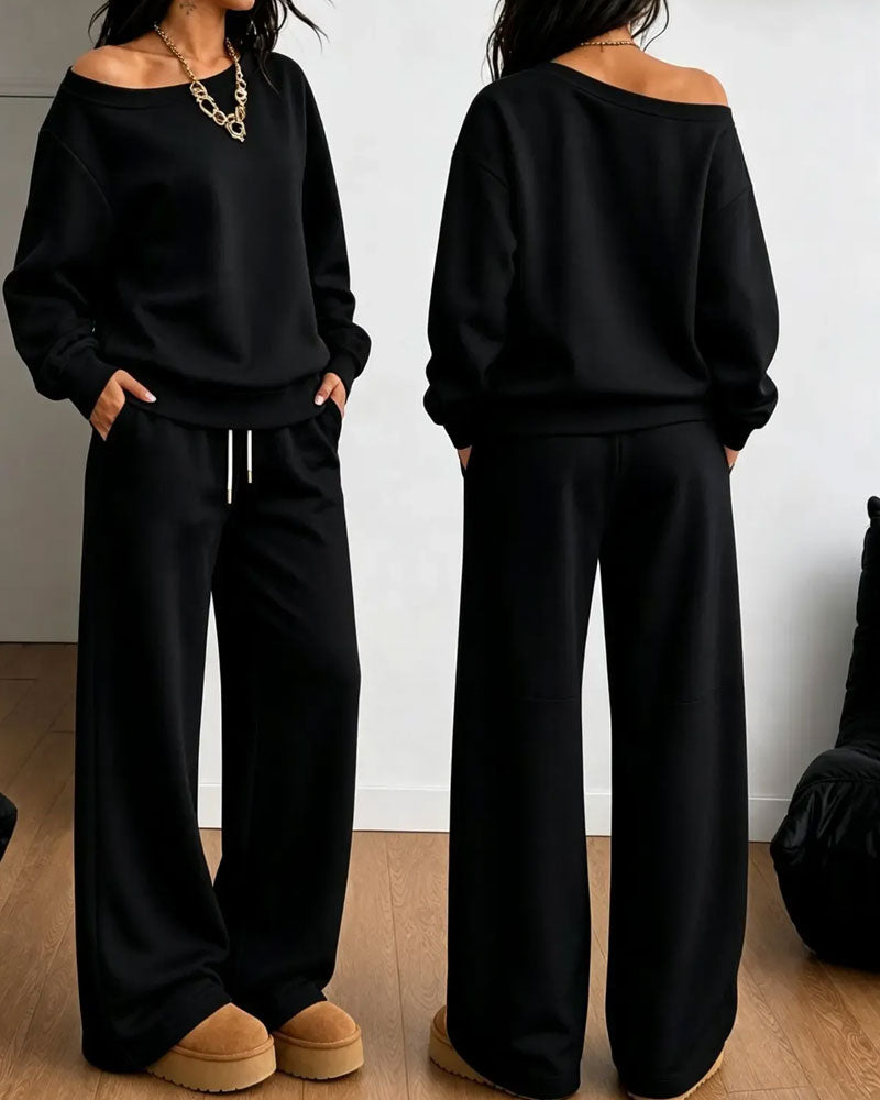 Women's asymmetric sweatshirt and wide-leg trousers set shown in white and black