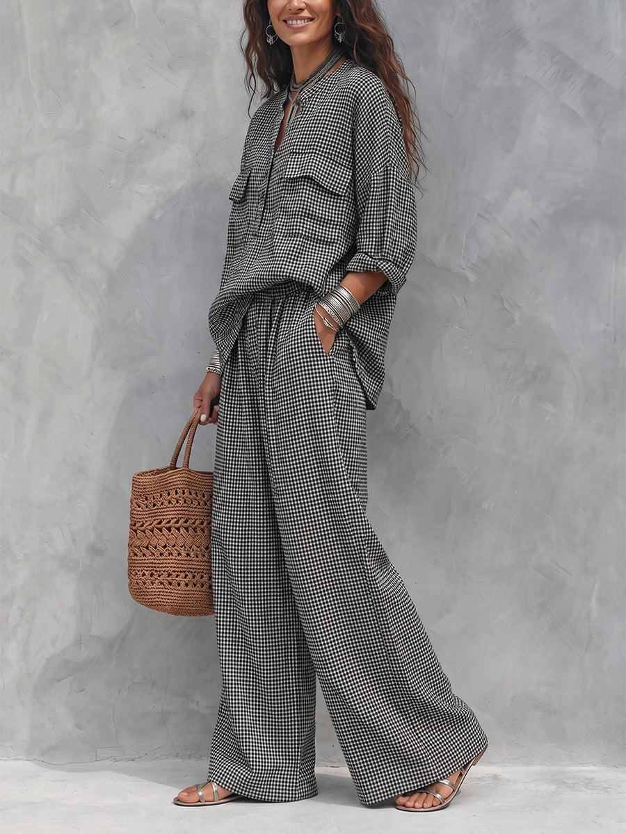 Women's black and white checked wide-leg trousers with elasticated waist and side pockets