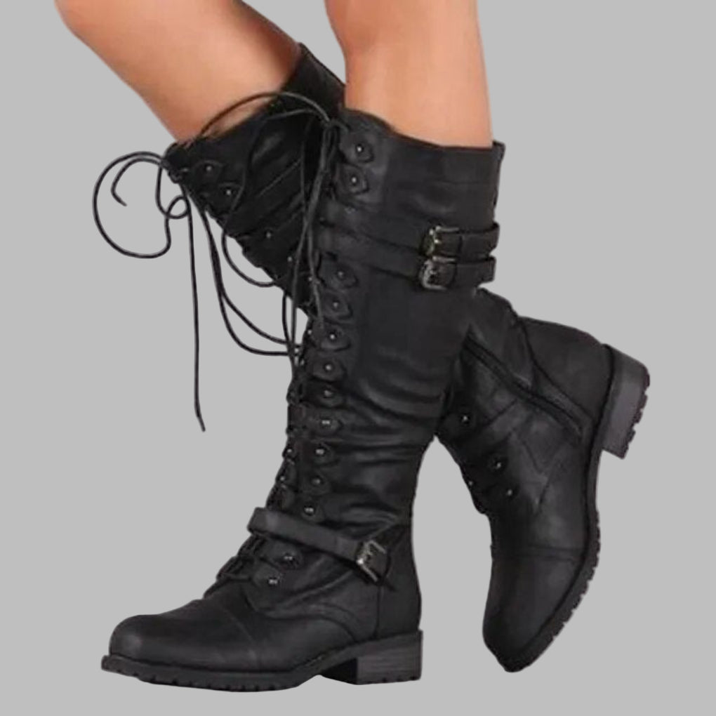 Women's mid-calf combat boots with front laces and buckled straps