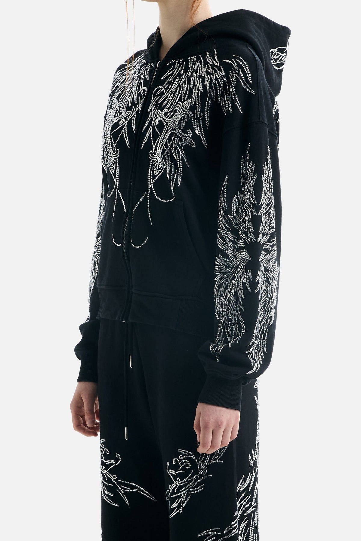 Black hoodie with silver rhinestone wing motifs, hood and zip front