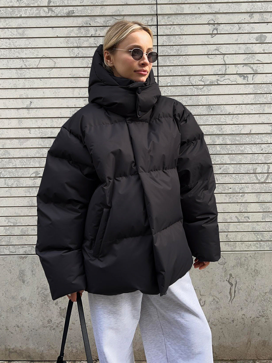 Women's hooded padded parka jacket with long sleeves and zip fastening