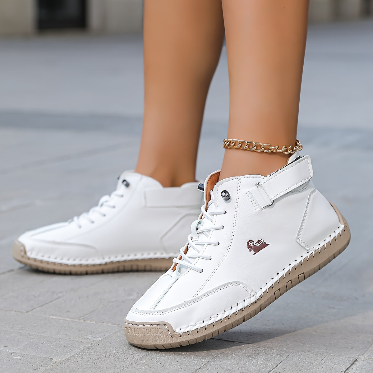 High-top lace-up sneakers with ankle straps and moc toes
