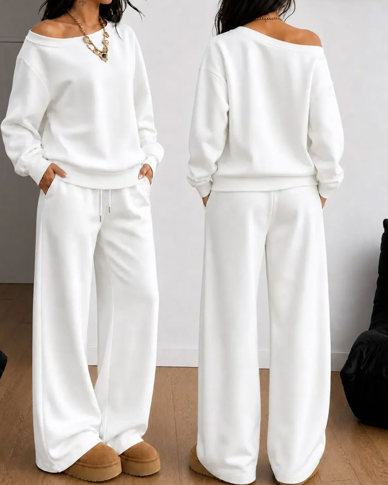 Women's asymmetric sweatshirt and wide-leg trousers set shown in white and black