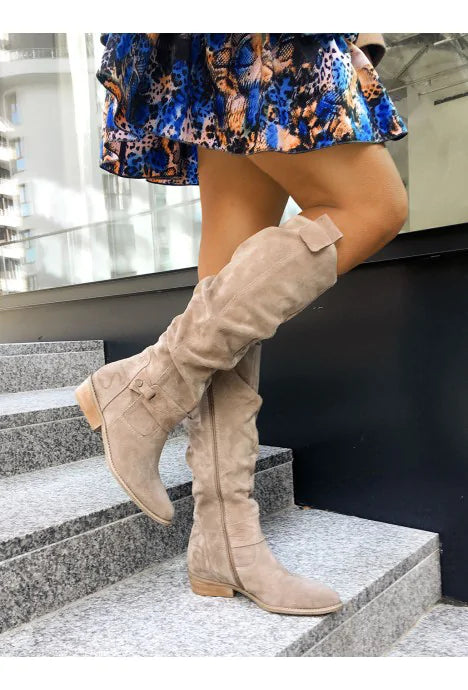 Women's slouch knee-high boots with pointed toes, flat heels and buckle details