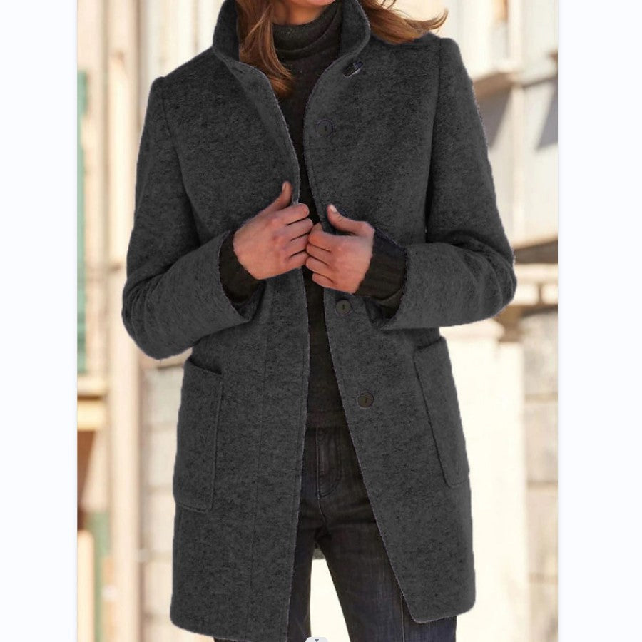Women's high-neck button front coat with long sleeves and patch pockets