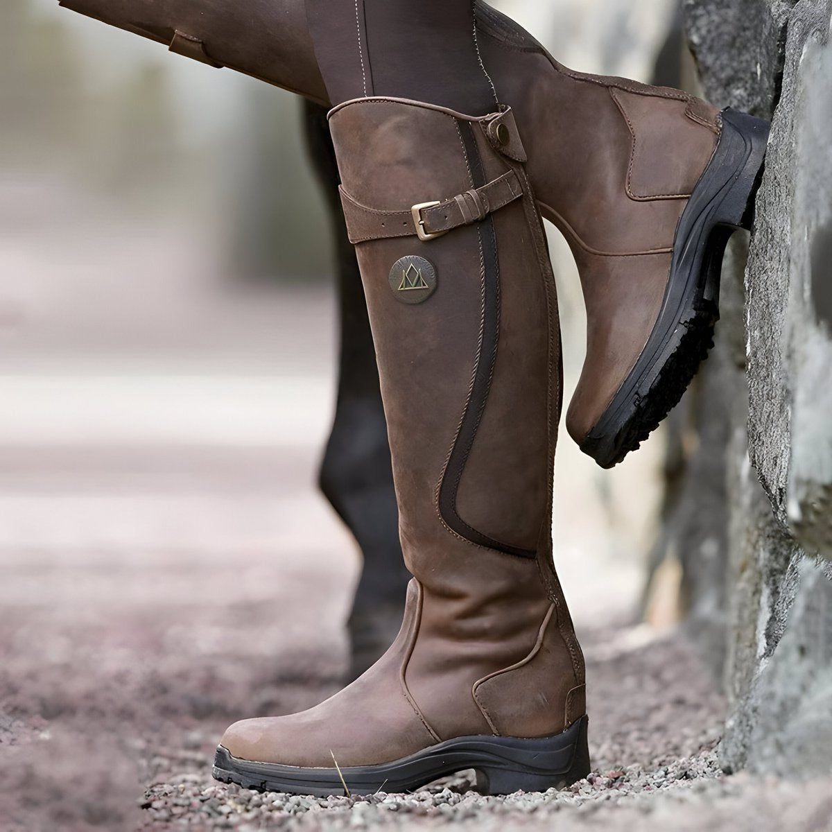 Women's knee-high riding boots with buckle strap and flat sole