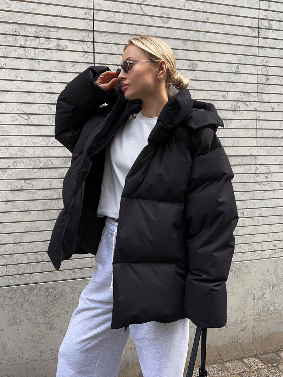 Women's hooded padded parka jacket with long sleeves and zip fastening
