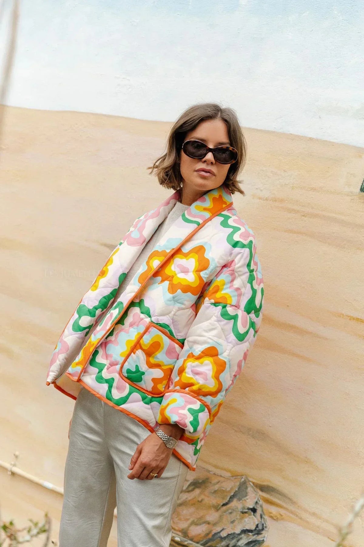 Women's multicoloured quilted floral jacket with orange edging and patch pockets