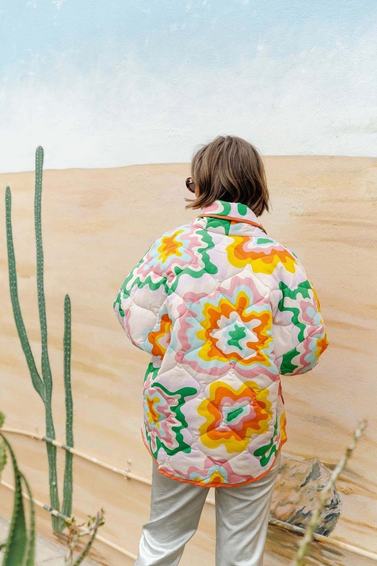 Women's multicoloured quilted floral jacket with orange edging and patch pockets