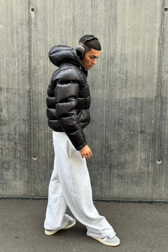 Men's hooded quilted puffer jacket with front zip and angled pockets