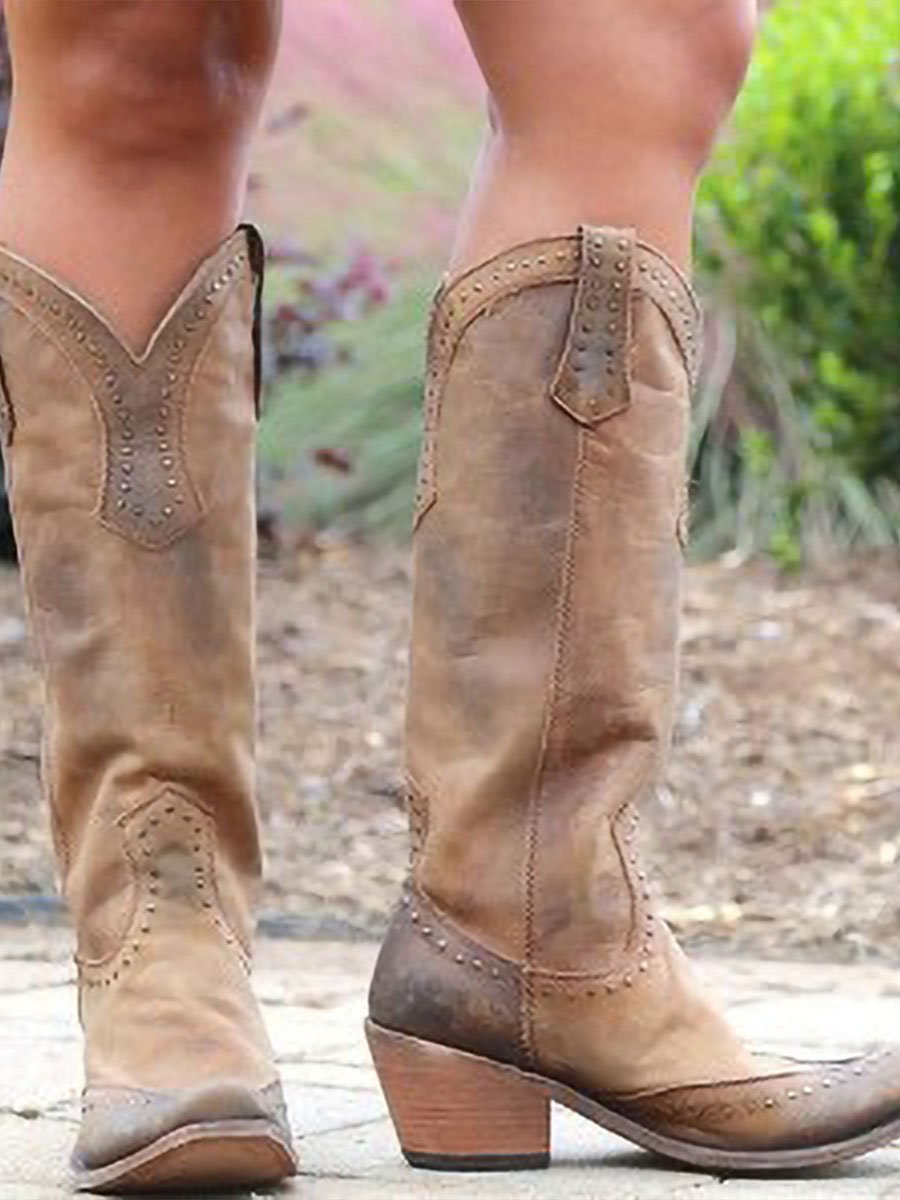 Women's studded cowboy boots with pointed toes, pull tabs and low heels