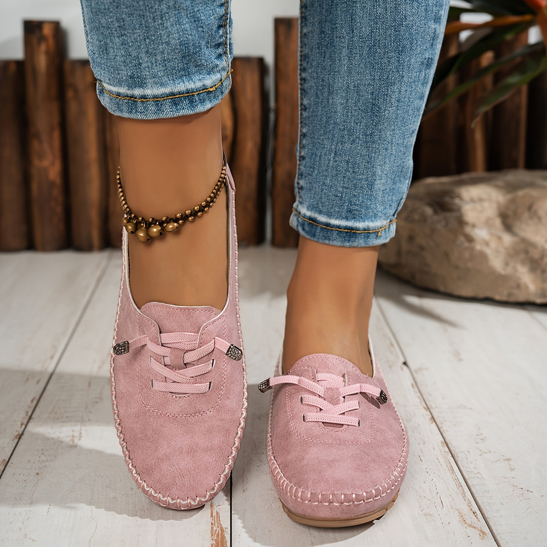 Women's moccasin loafers with lace detail, stitched trim and flat textured soles