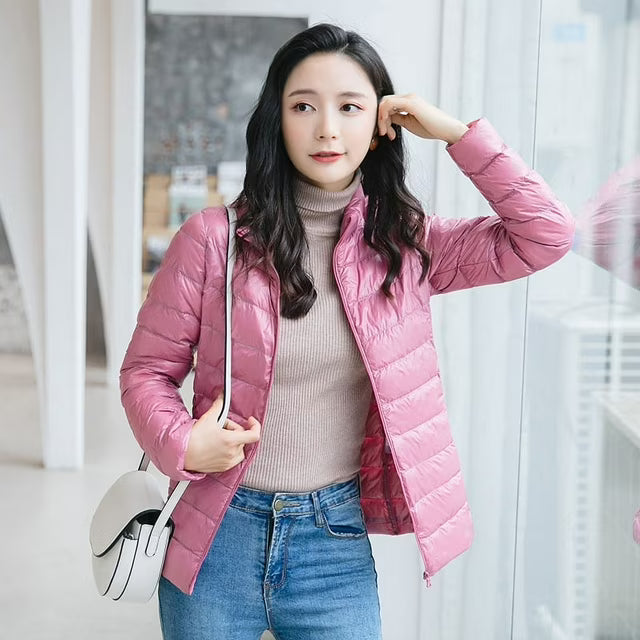 Women's quilted puffer jacket with high collar and zip front