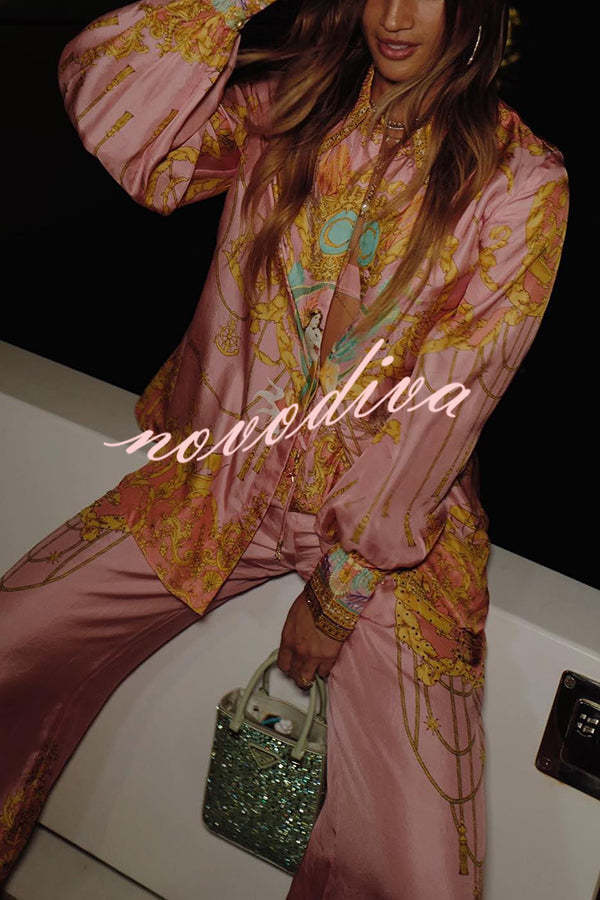 Woman wearing a pink abstract print shirt and wide-leg trousers set