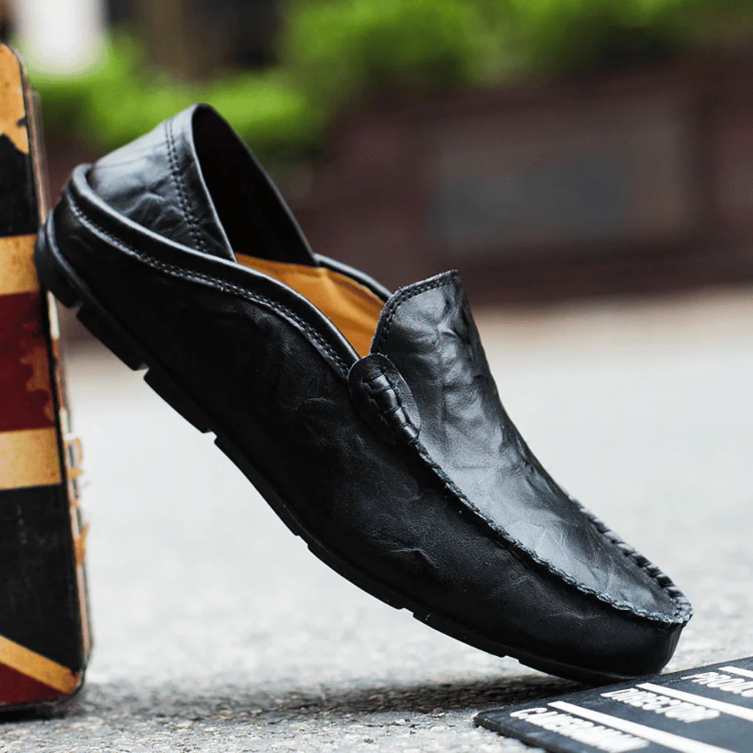 Men's slip-on loafer with stitched moc toe and decorative vamp trim
