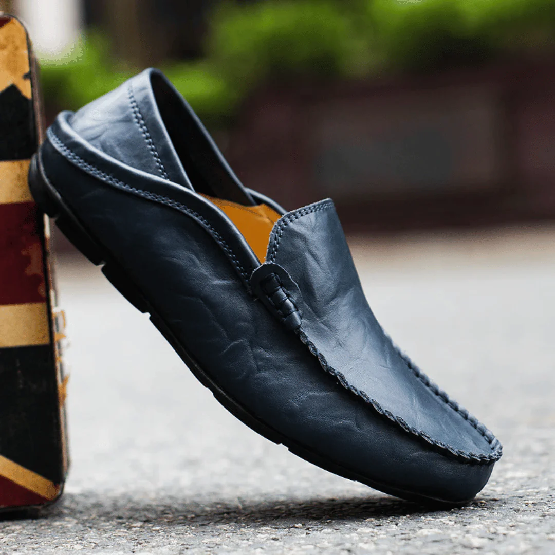 Men's slip-on loafer with stitched moc toe and decorative vamp trim