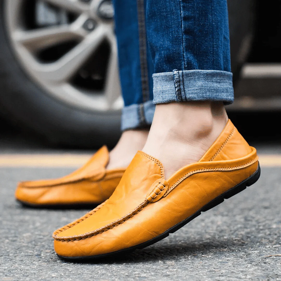 Men's slip-on loafer with stitched moc toe and decorative vamp trim