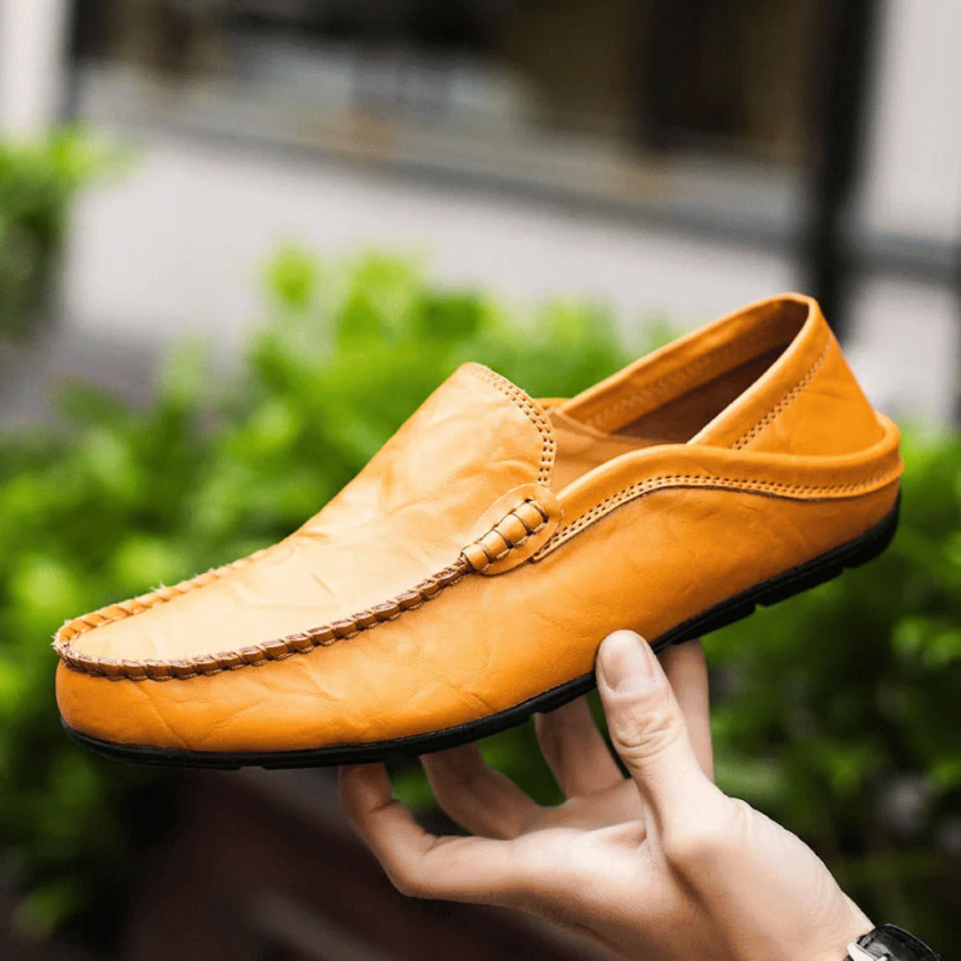 Men's slip-on loafer with stitched moc toe and decorative vamp trim