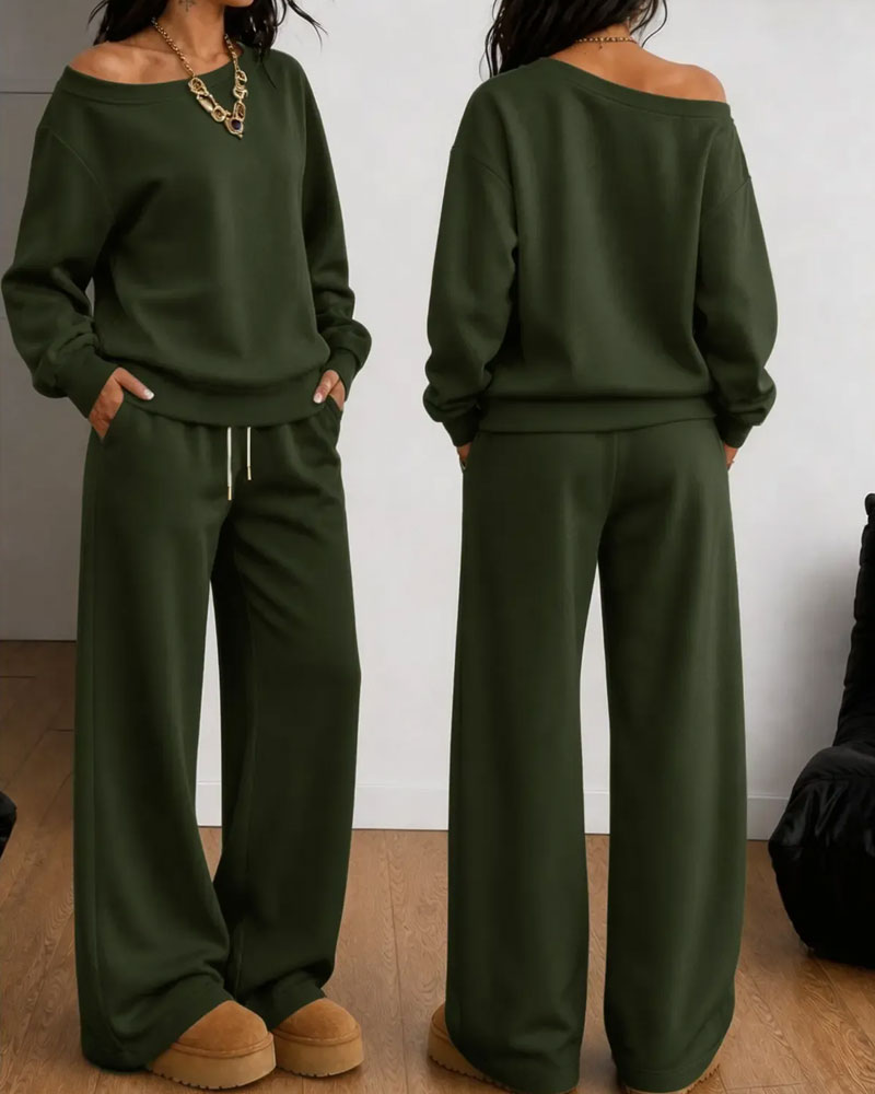 Women's asymmetric sweatshirt and wide-leg trousers set shown in white and black