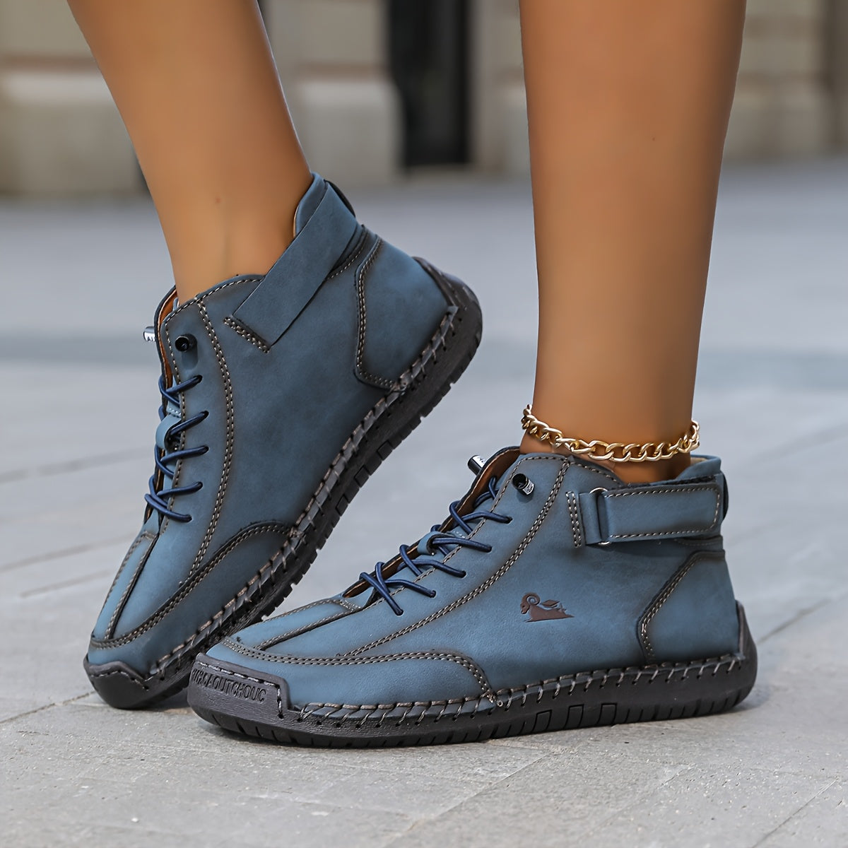High-top lace-up sneakers with ankle straps and moc toes