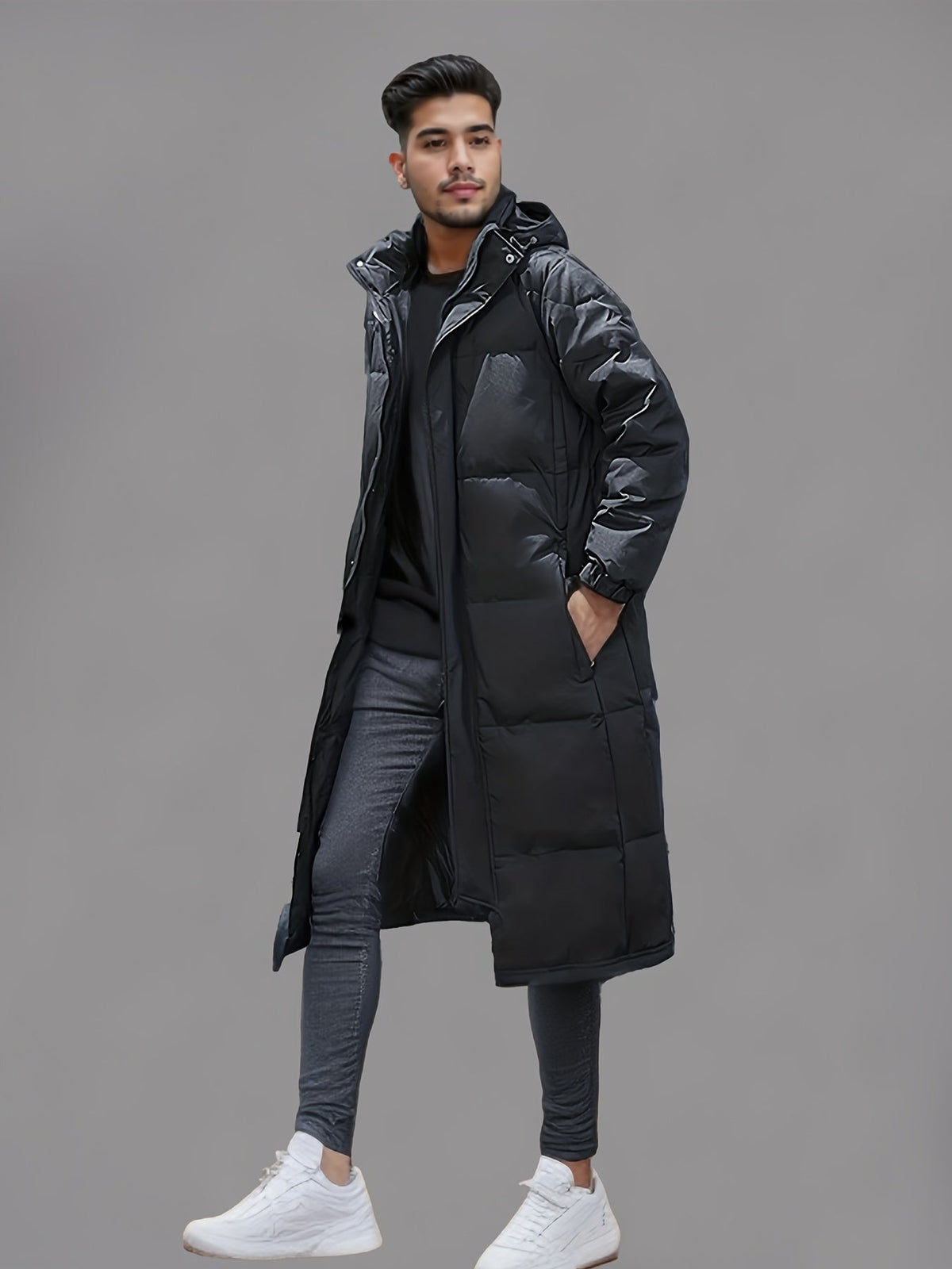 Men's black long hooded puffer coat with quilted panels and front zip