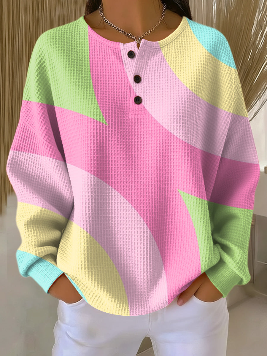 Women's pink geometric pattern jumper with crew neck, button placket and long sleeves