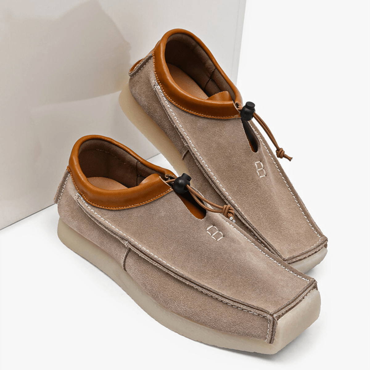 Square-toe loafers with contrast trim, toggle cord fastening and flat soles