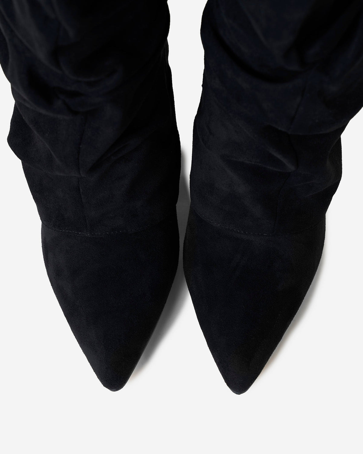 Black women's slouchy knee-high boots with pointed toes and gold-tone strap details