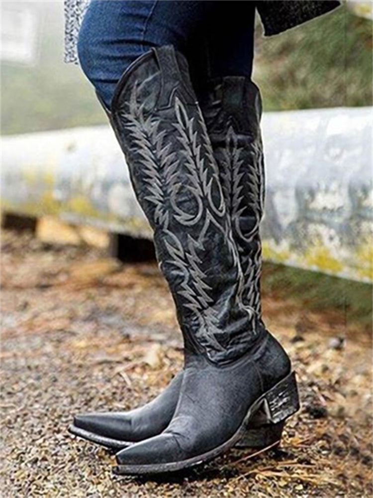 Knee-high western cowboy boots with embroidered botanical detailing and pointed toes