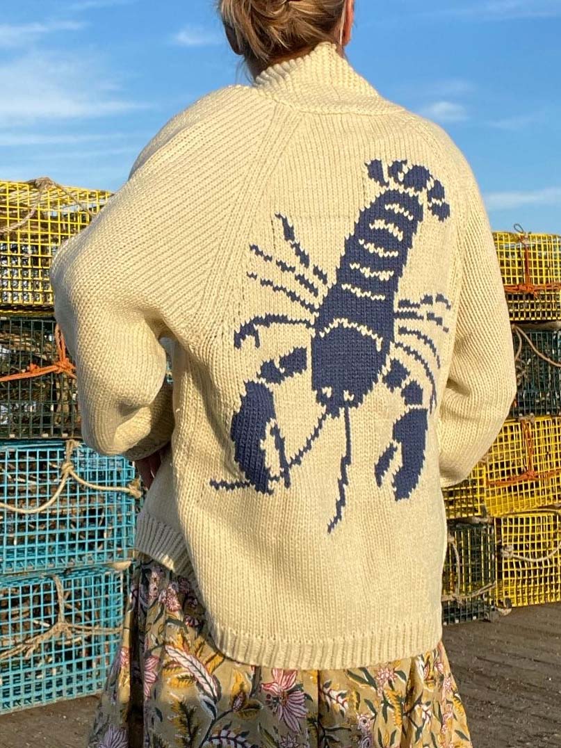 Women's cream cardigan with navy lobster motif, shawl collar and front pockets