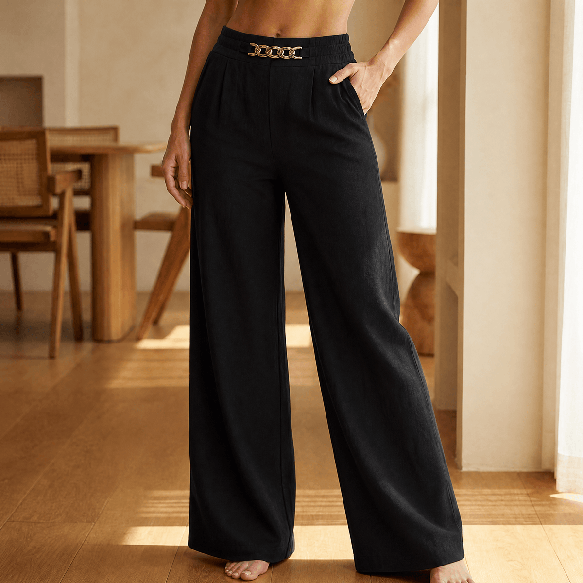 Women's wide leg trousers with high elasticated waist, side pockets and chain detail