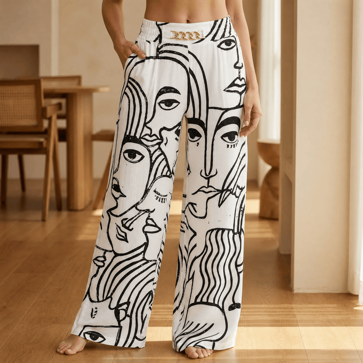 Women's wide leg trousers with high elasticated waist, side pockets and chain detail