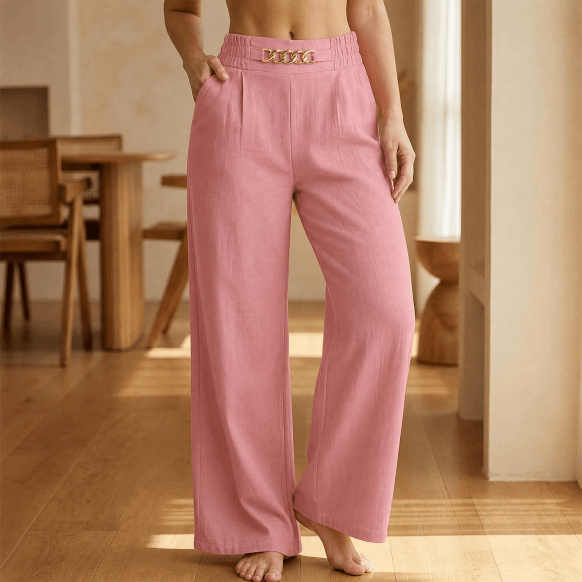 Women's wide leg trousers with high elasticated waist, side pockets and chain detail