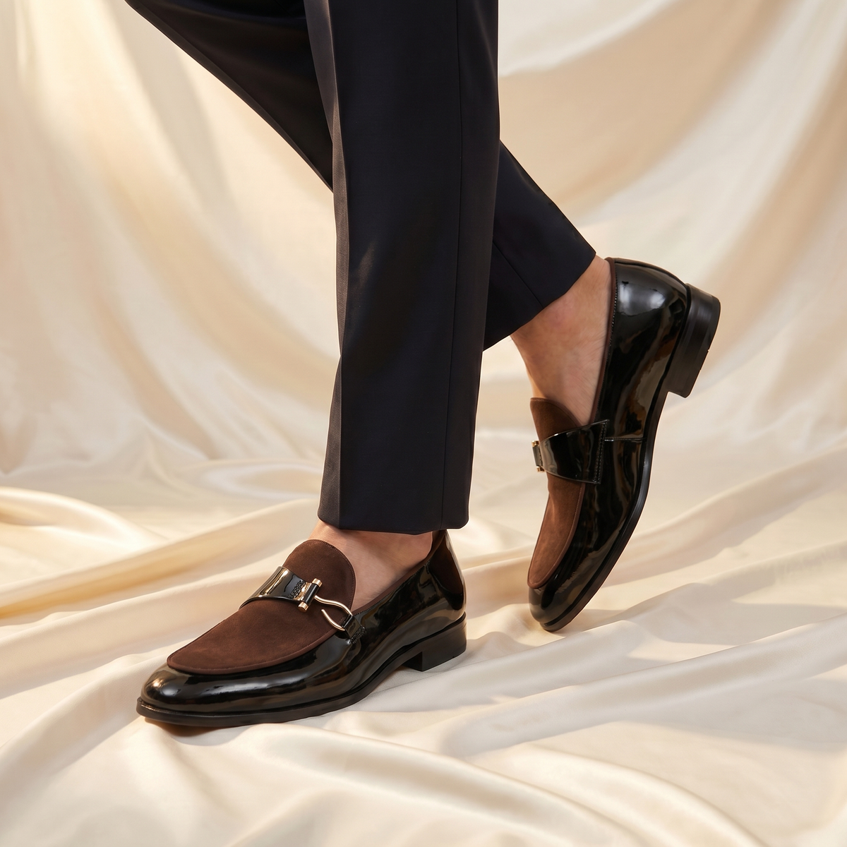 Men's slip-on loafers with almond toe, glossy finish and buckle trim