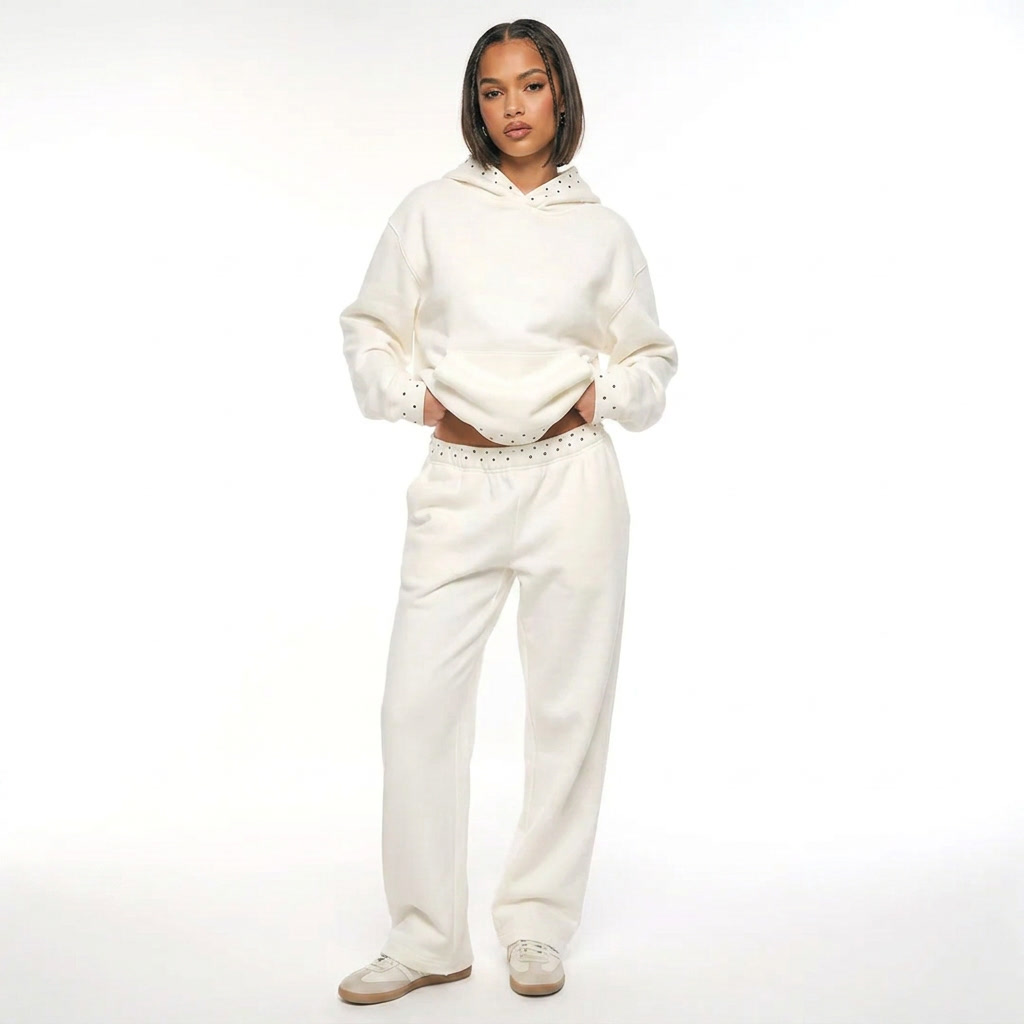 Women's white hooded lounge set with dotted trim and full-length trousers