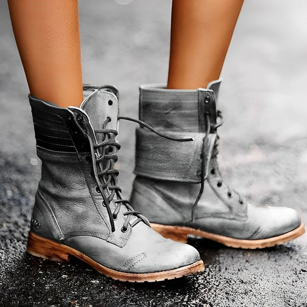 Women's lace-up combat ankle boots with rounded toes, ankle straps and low heels