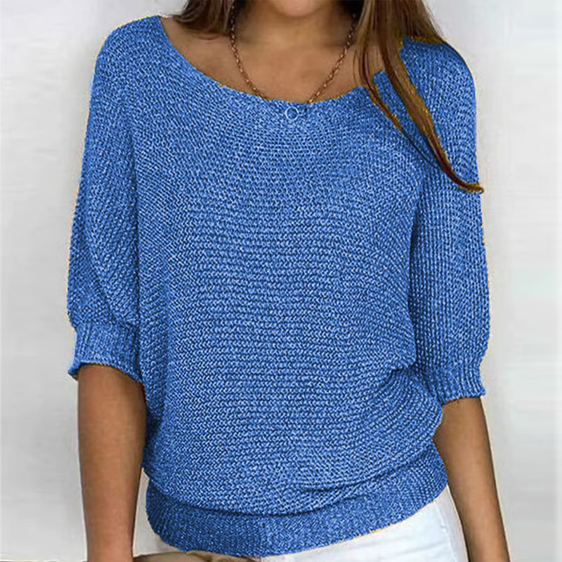 Women's relaxed plain knit sweater with round neckline and three-quarter sleeves