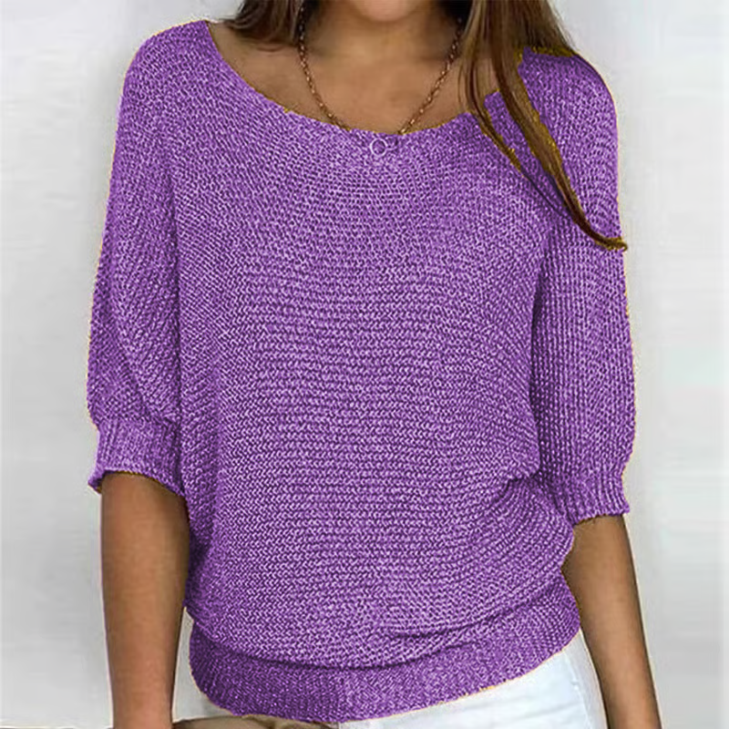 Women's relaxed plain knit sweater with round neckline and three-quarter sleeves
