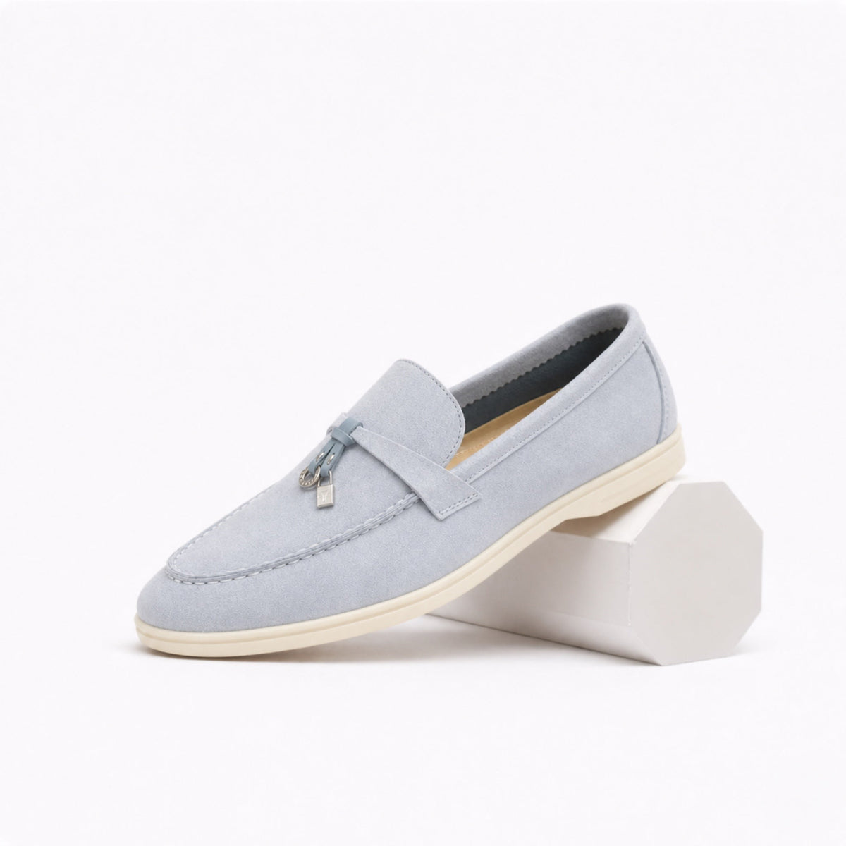 Women's slip-on loafers with metal vamp trim and flat soles