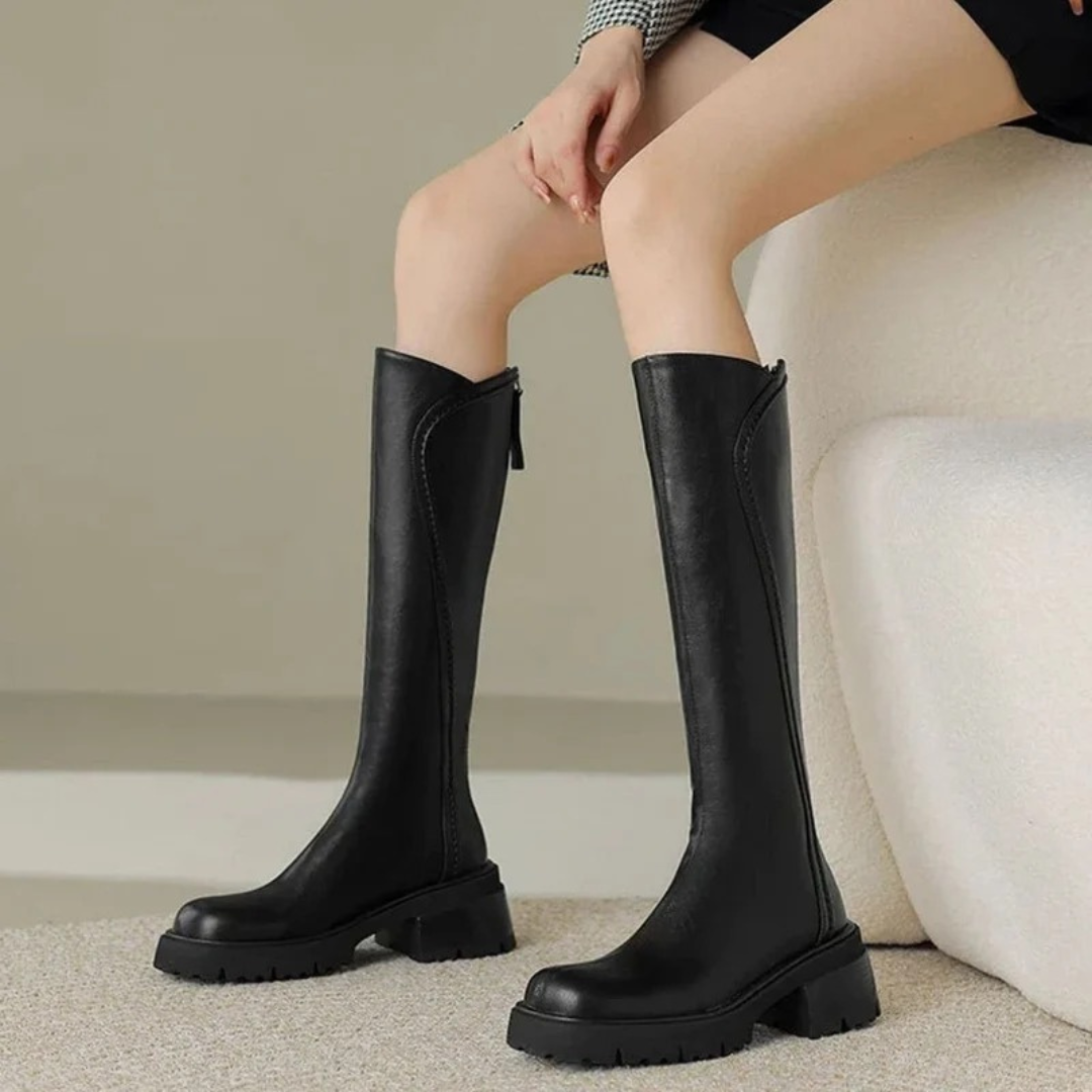 Women's tall boots with round toes, side zips, low block heels and lugged soles