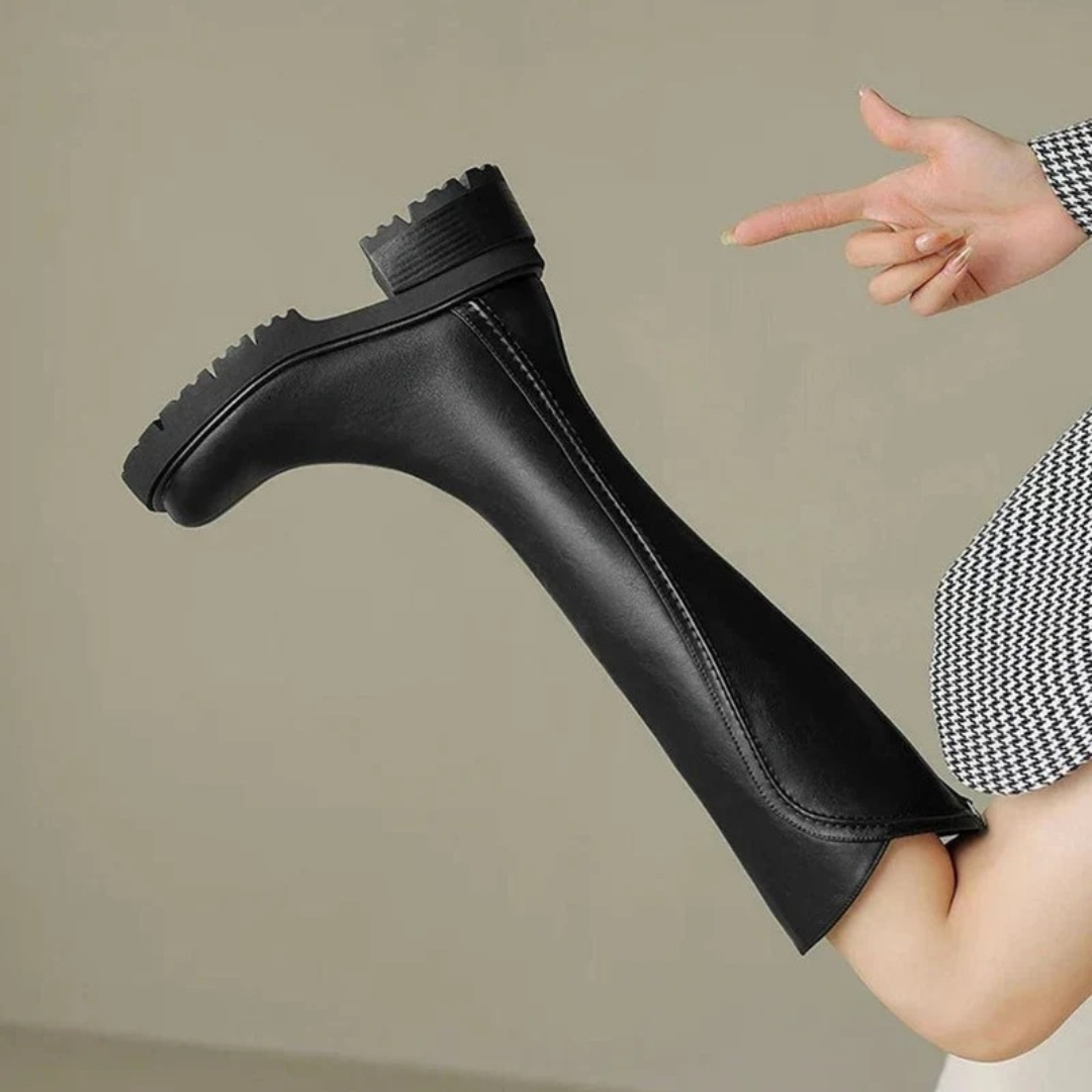Women's tall boots with round toes, side zips, low block heels and lugged soles