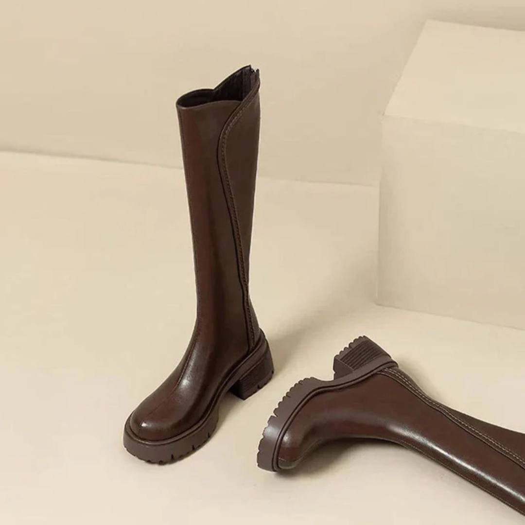 Women's tall boots with round toes, side zips, low block heels and lugged soles
