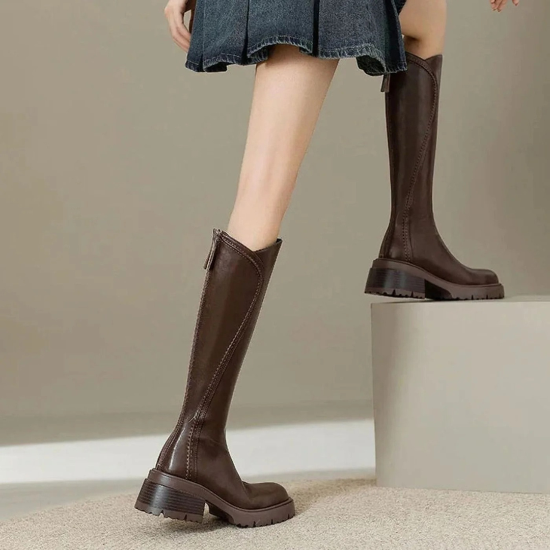Women's tall boots with round toes, side zips, low block heels and lugged soles