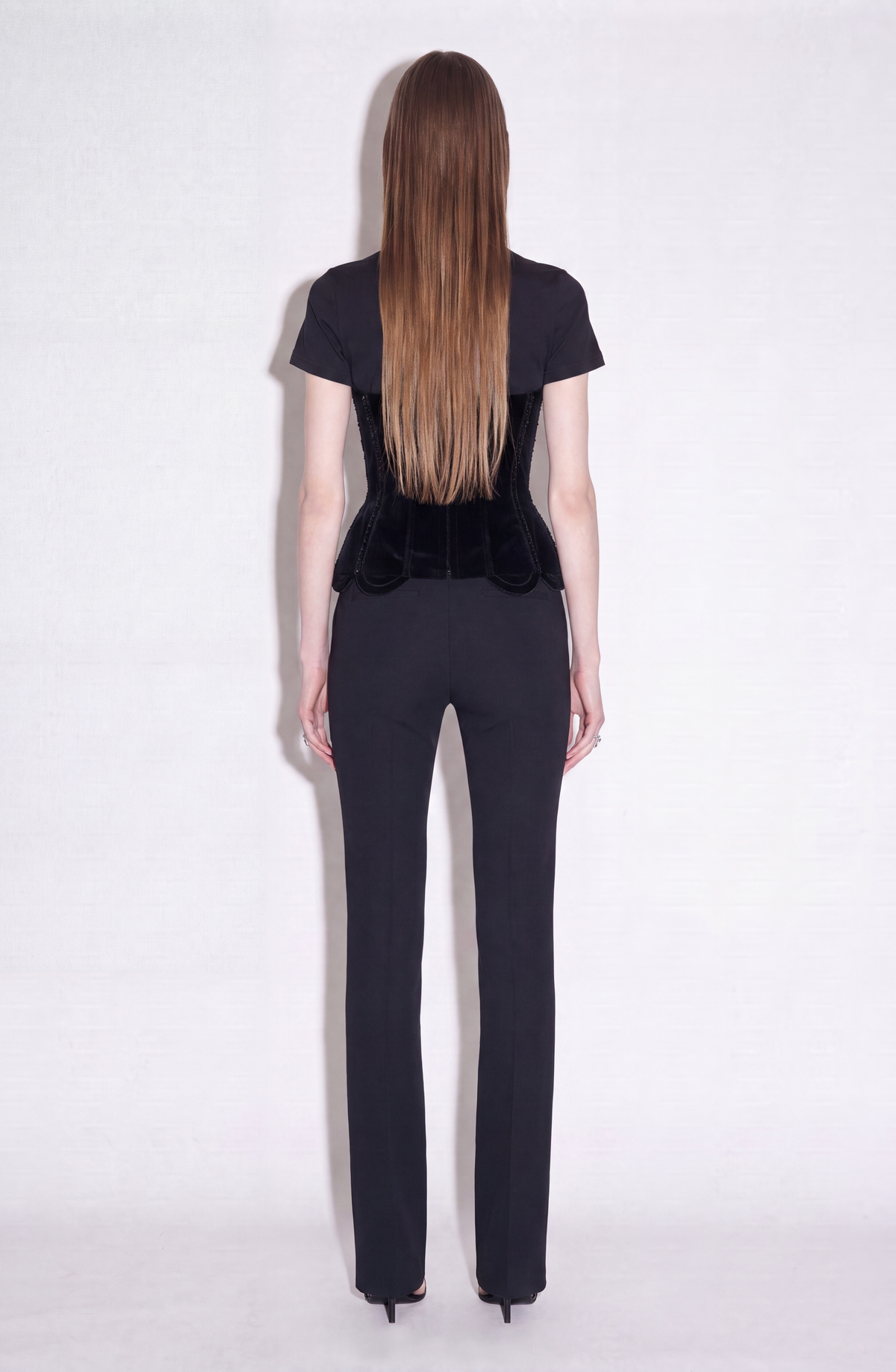 Black short-sleeve T-shirt with structured corset-style front and sparkling trim