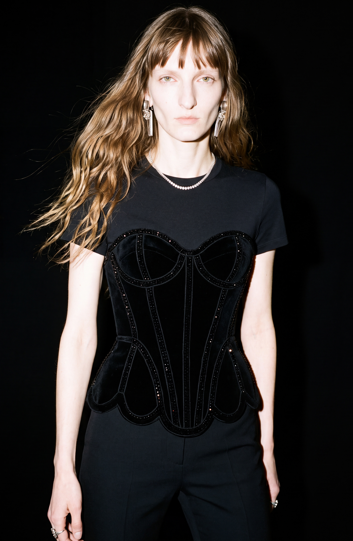 Black short-sleeve T-shirt with structured corset-style front and sparkling trim
